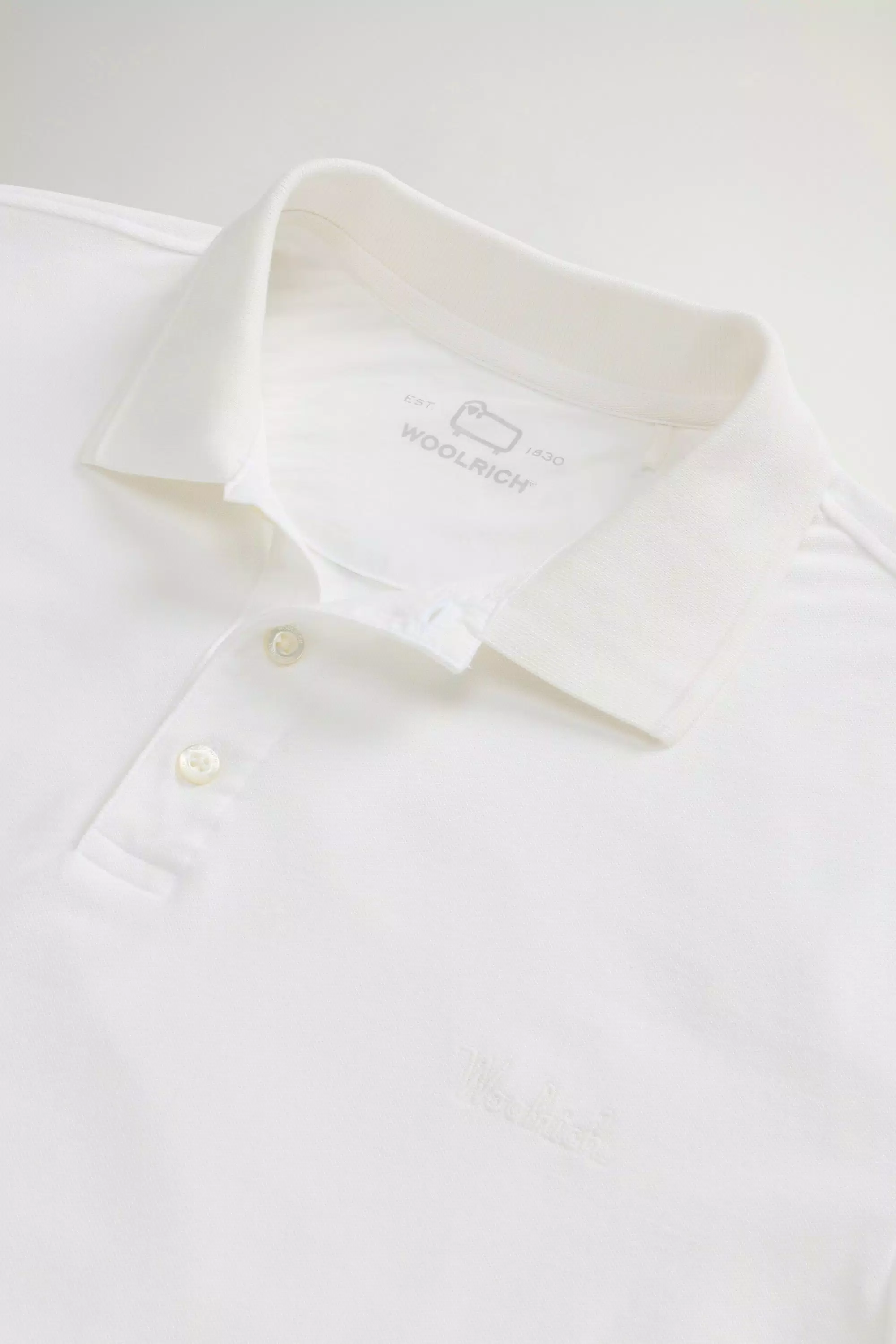 Gedüngtes Mackinack-Polo-Shirt aus dehnbarem Baumwoll-Piqué - Verblasstes Arktisweiß